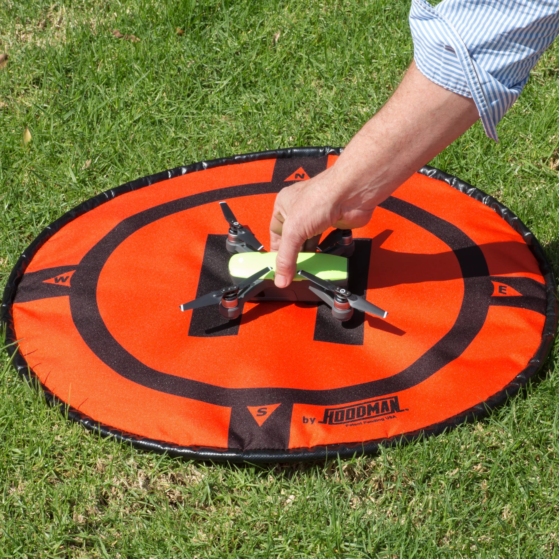 Small drone on Hoodman weighted drone landing pad